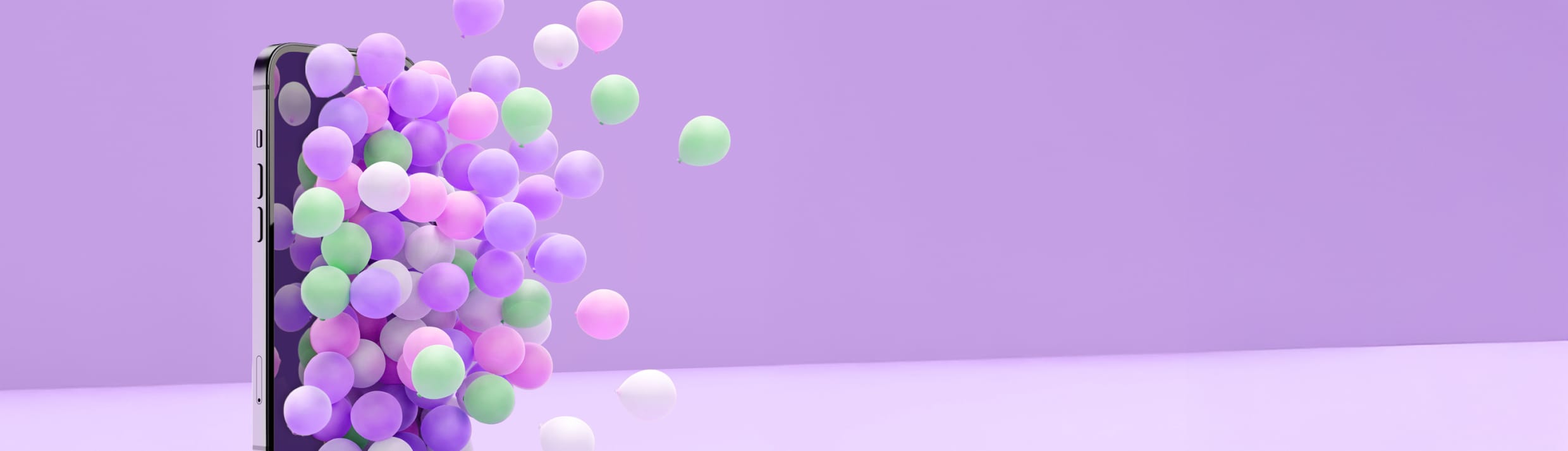Un iPhone inconnu avec des ballons sur fond violet.